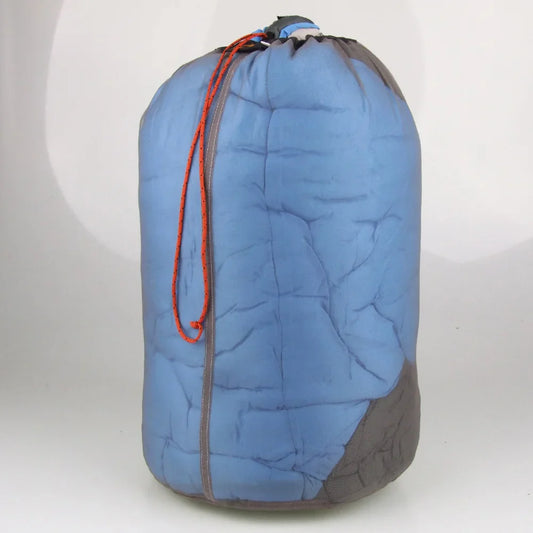 An AlphaLife247 ultralight drawstring mesh stuff sack in gray, showcasing its breathable design and round-base construction, ideal for organizing and drying expedition gear.