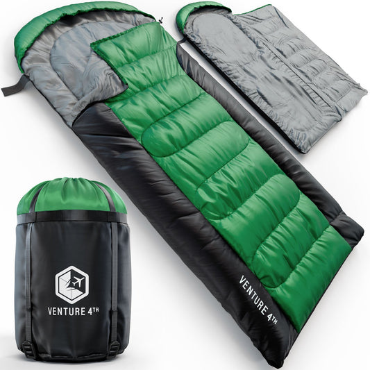 A Venture 4th branded XXL sleeping bag, from AlphaLife247, in green and charcoal, displayed alongside its black carrying case, highlighting the oversized rectangular design for big and tall outdoor enthusiasts.