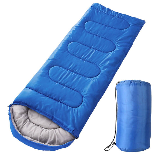 An AlphaLife247 3-season sleeping bag shown partially unzipped on a camping site, highlighting its durable polyester construction and hollow cotton insulation for outdoor thermal comfort.