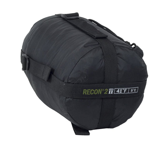 An AlphaLife247 Recon 2 military-style mummy sleeping bag in black, showcasing its compact compression sack and tactical branding for expedition-ready thermal protection.