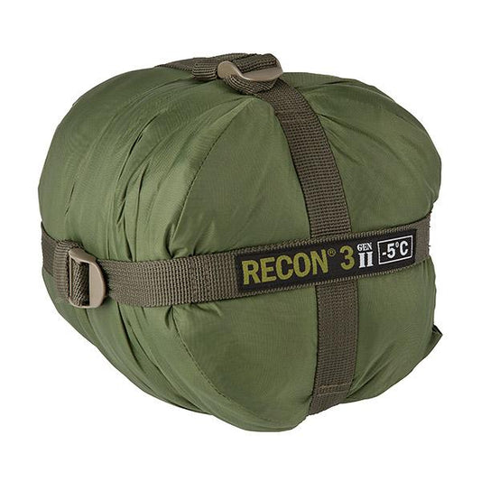 An AlphaLife247 Recon 3 military-style mummy sleeping bag in olive drab, shown in its compact spider compression sack, highlighting its tactical, expedition-ready design for backcountry operations.